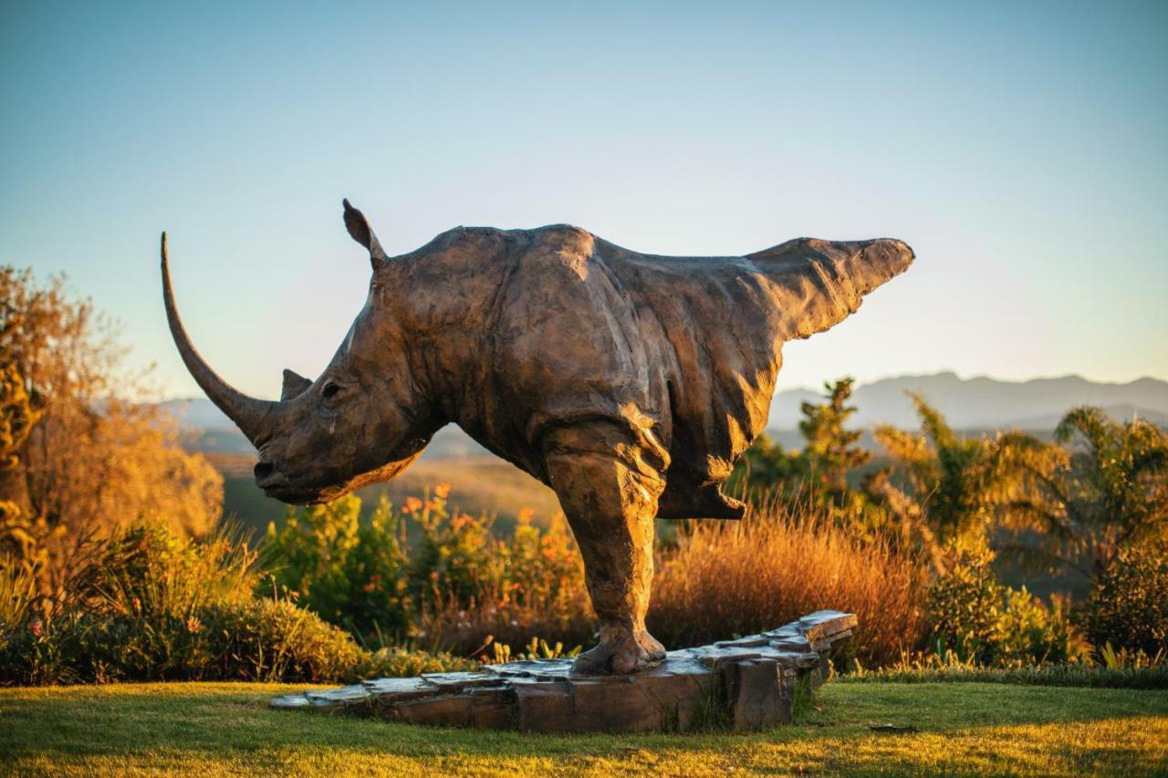 Sky Villa Boutique Hotel By Raw Africa Collection Plettenberg Bay Exterior photo The sculpture of a white rhinoceros at the entrance of the park